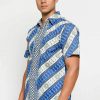 Short sleeve shirt Didesain etnik dalam batik printing Pointed collar Front button opening Material : Katun prima