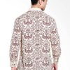 • Long sleeves shirt • Didesain etnik dalam motif batik • Pointed collar, hidden button opening • Detail button of cuffs • Material : Katun Prima