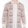 • Long sleeves shirt • Didesain etnik dalam motif batik • Pointed collar, hidden button opening • Detail button of cuffs • Material : Katun Prima