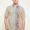 Short sleeves shirt Desain ethnic dalam motif batik Pointed collar, hidden button opening Left chest pocket Material : Cotton primis